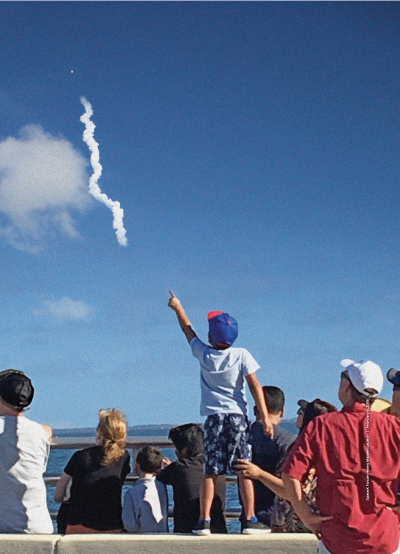 A crowd watches a launch from Titusville, Florida.