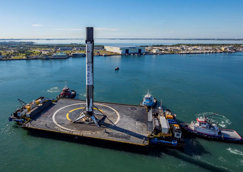 Droneship Of Course I Still Love You berthing at Port Canaveral with a Falcon 9 booster. Image Credit SPACEX